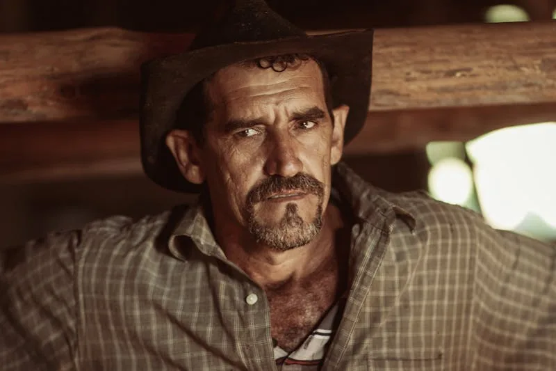 grit and determination on the face of a farmer