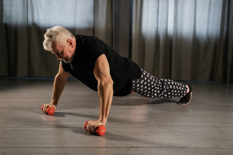 Stay Strong After 60: Bodyweight Strength Training for Seniors at Home 2 senior man performing pushups