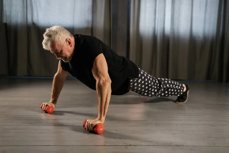 senior man performing bodyweight strength training for seniors with push-ups