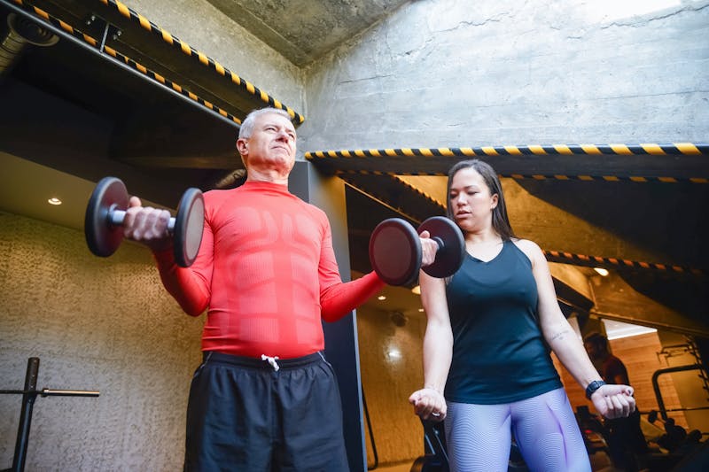 Fit After 60: 7 Powerful Reasons Senior Fitness Matters 3 fit after 60 man lifting dumbbells
